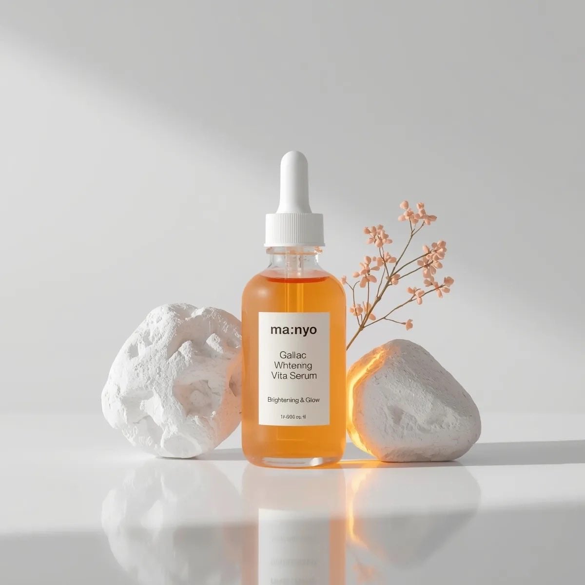 Minimalist studio product photography of an amber glass dropper serum bottle wit
