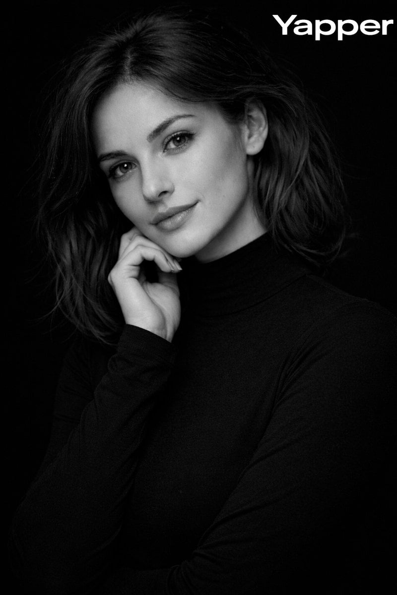 {
"prompt": "High-contrast monochromatic studio portrait of a European woman aro
