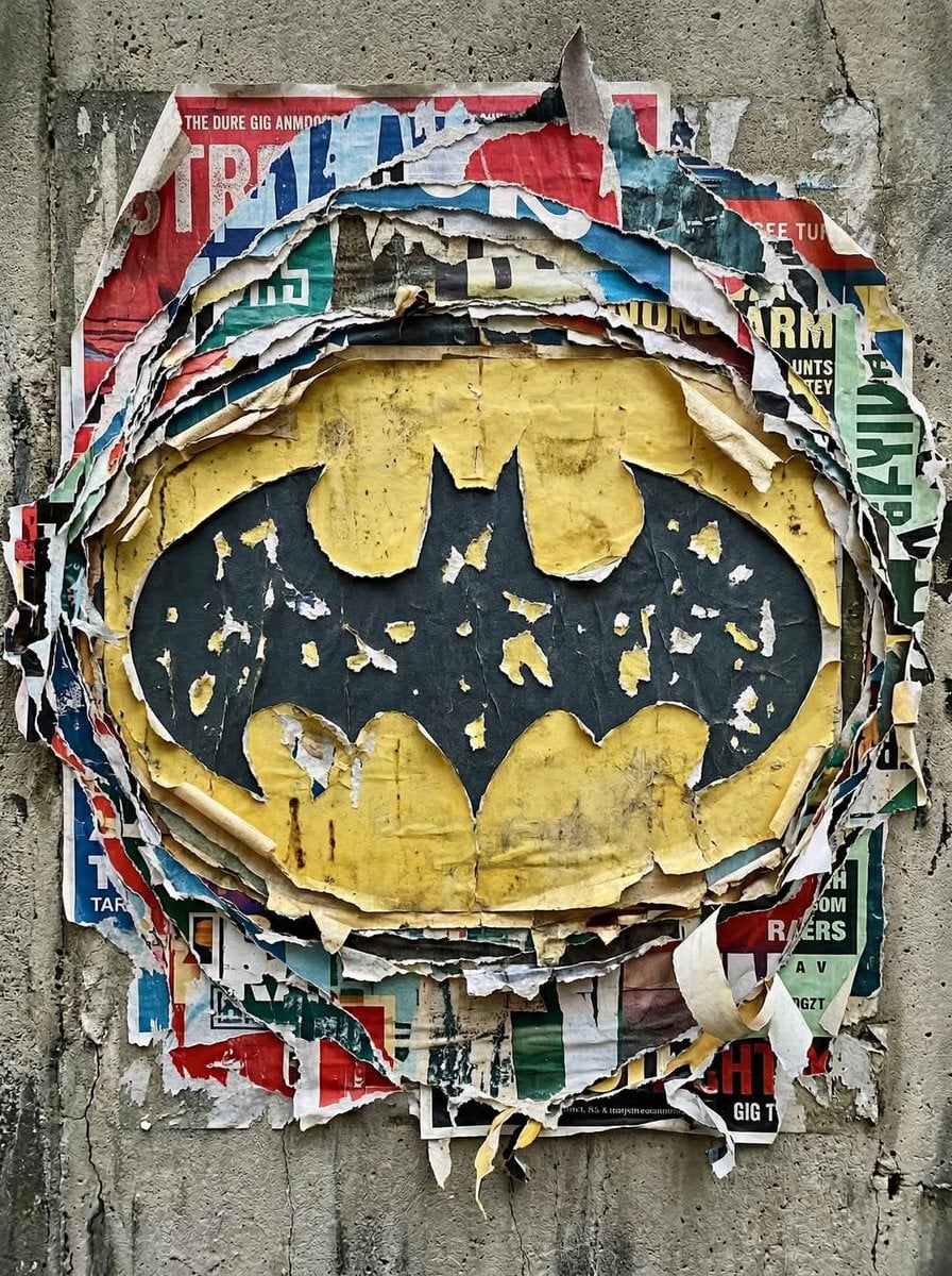Transform the uploaded logo into a realistic urban wall scene where the logo sil