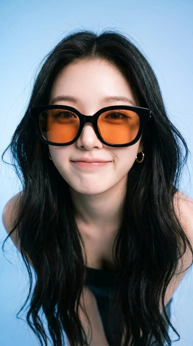 Photorealistic editorial portrait of a smiling woman using the exact same face f
