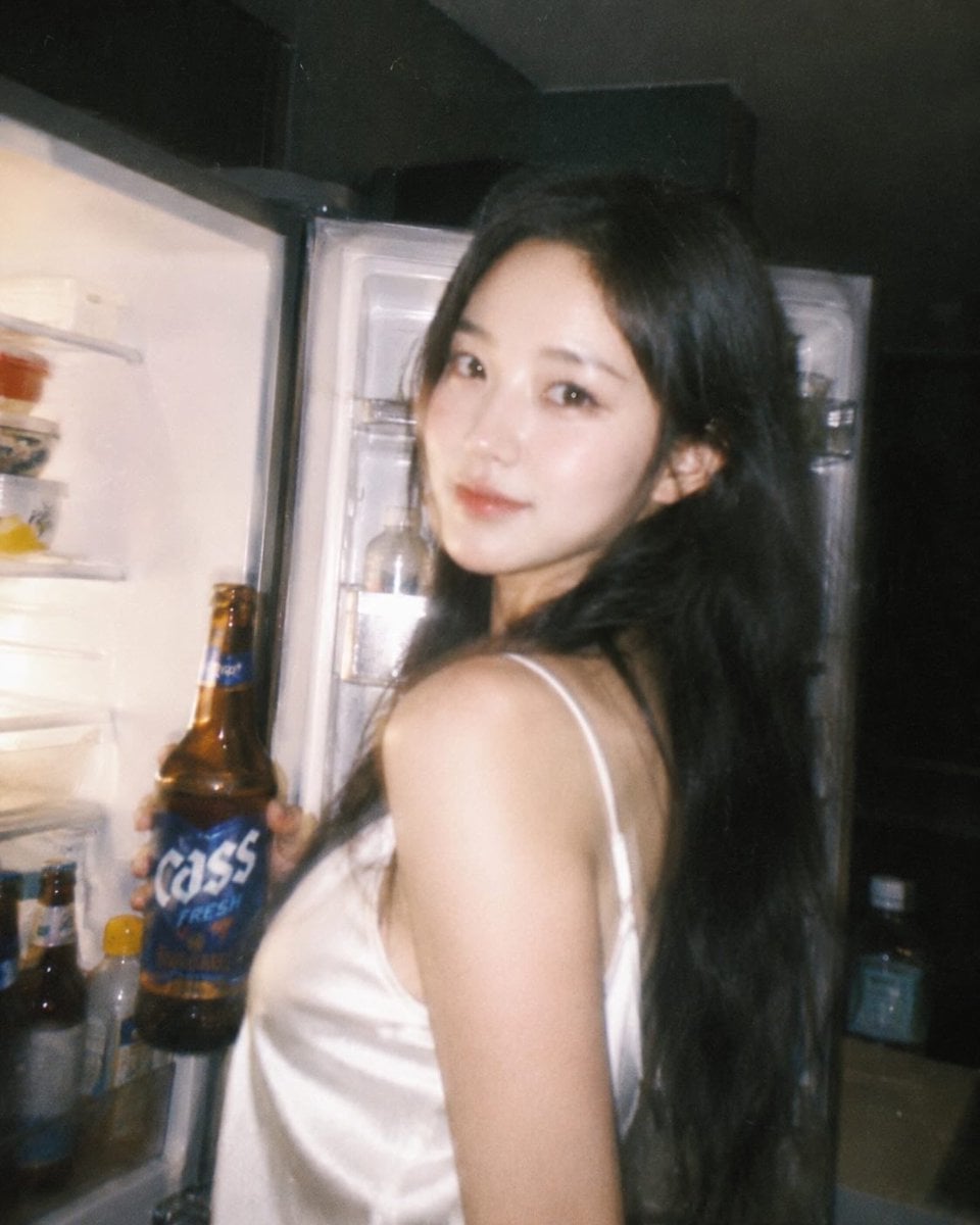 Ultra-realistic candid night photography of a beautiful East Asian woman with lo