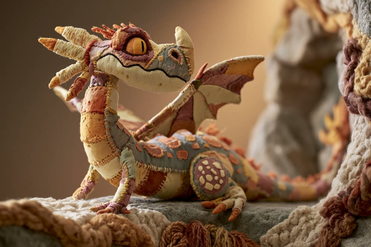 A stop-motion animation style scene featuring a whimsical fabric sculpture of a 