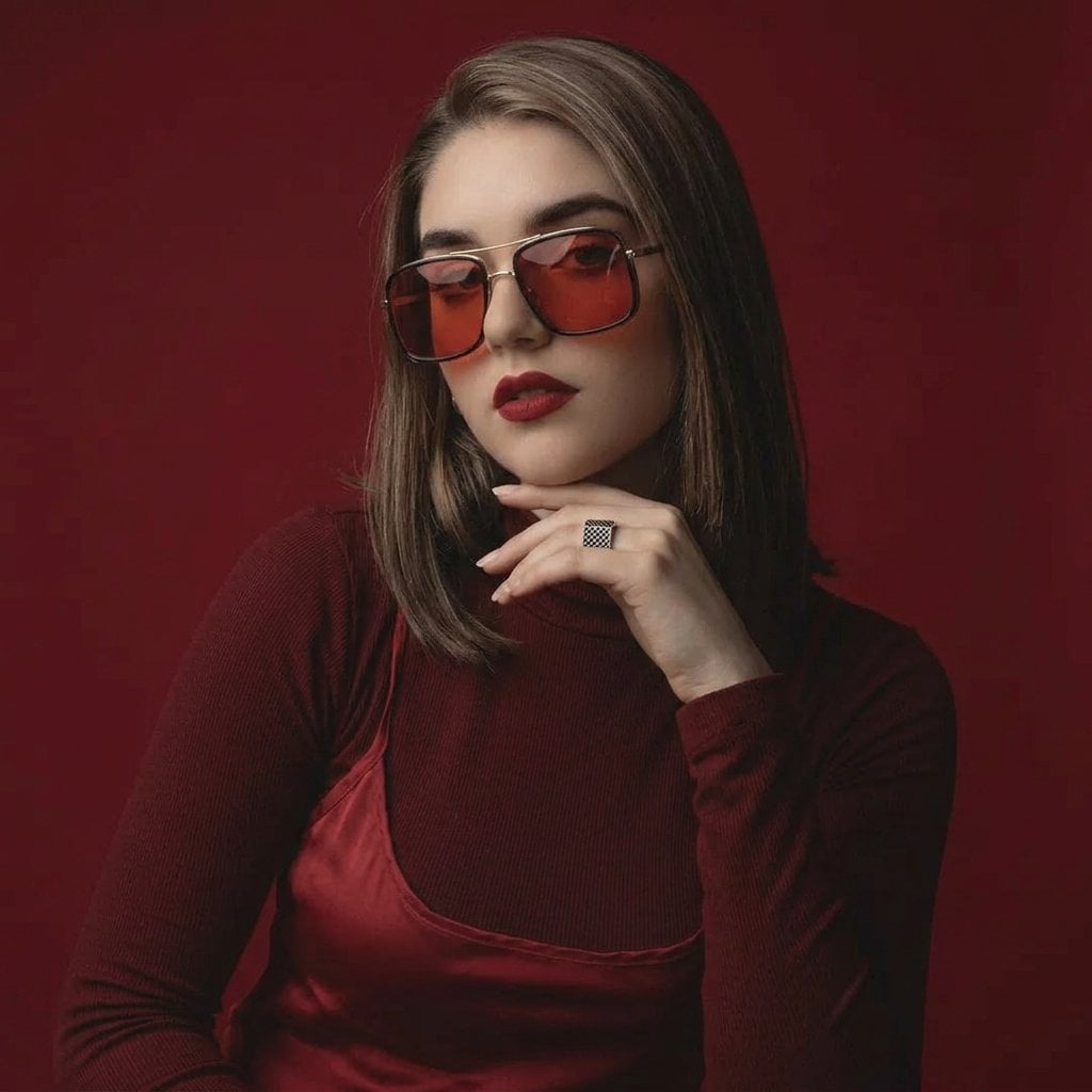 High-fashion beauty portrait of young woman with sleek center-parted brunette ha