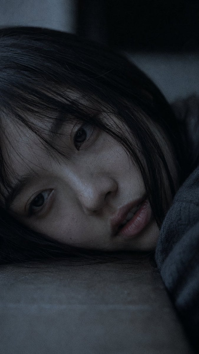 Portrait shot on 85mm f/1.2, close-up of a Japanese woman in her early 20s, stra
