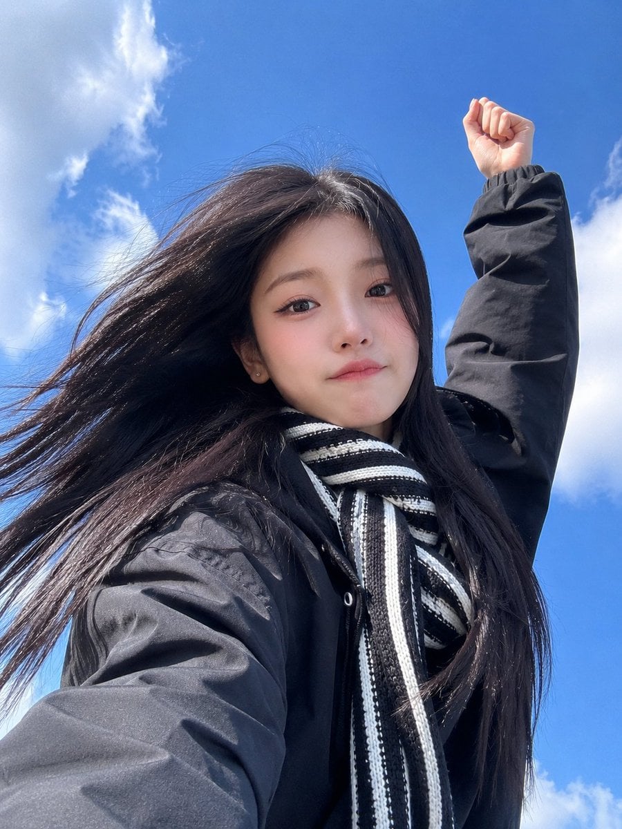 Ultra-realistic smartphone selfie of a beautiful young East Asian woman taken fr