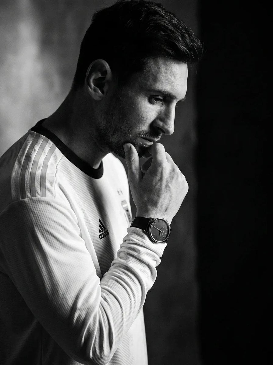 Create an ultra-realistic black-and-white editorial portrait of the uploaded per